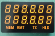 A close-up of a black industrial digital display module with orange LED digits showing '1888.8.