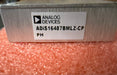 Electronic component with Analog Devices label on a pink textured background ADiS16487BMLZ-CP