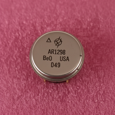 Circular component with text on a pink textured background