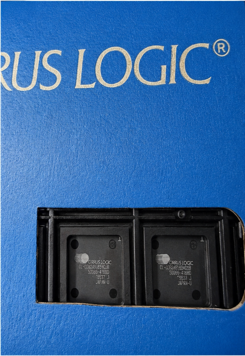 A close-up shot of a black Circus Logic CL-GD6245-65VC-B integrated circuit chip in a black carrier package, with white printed text and a blue surface visible around it.