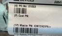 A close-up of a white product label with black printed text and barcodes, placed on a wooden surface next to a metallic object. The label includes product identifiers such as P.