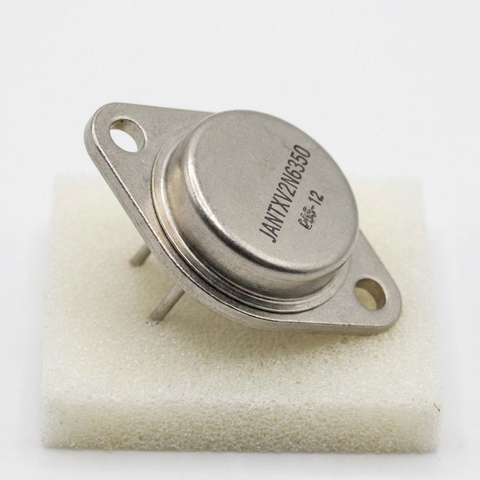 Metalic electronic component on a white background