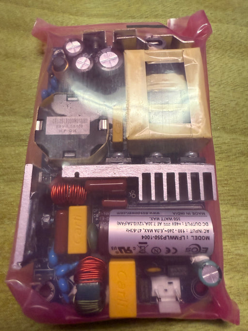 Electrical component with visible branding on a green background