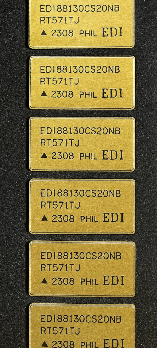 Close-up of multiple EDI88130CS20NB by EDI electronic components with gold-colored casing and printed model numbers